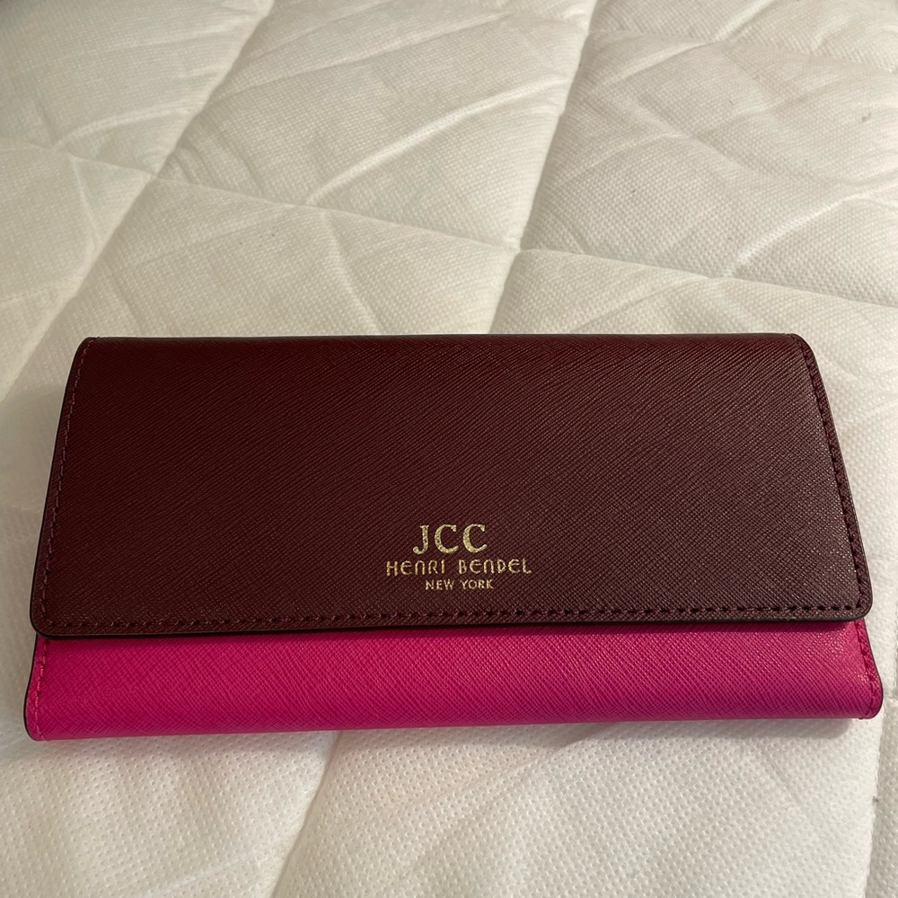 Never used. Henri Bendel two tone wallet. Beautiful rich pink and maroon
